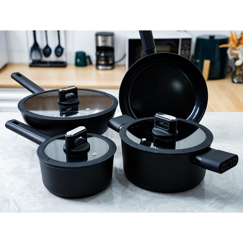 What unique health benefits does the black and white ceramic seven-piece non-stick pan offer during cooking?
